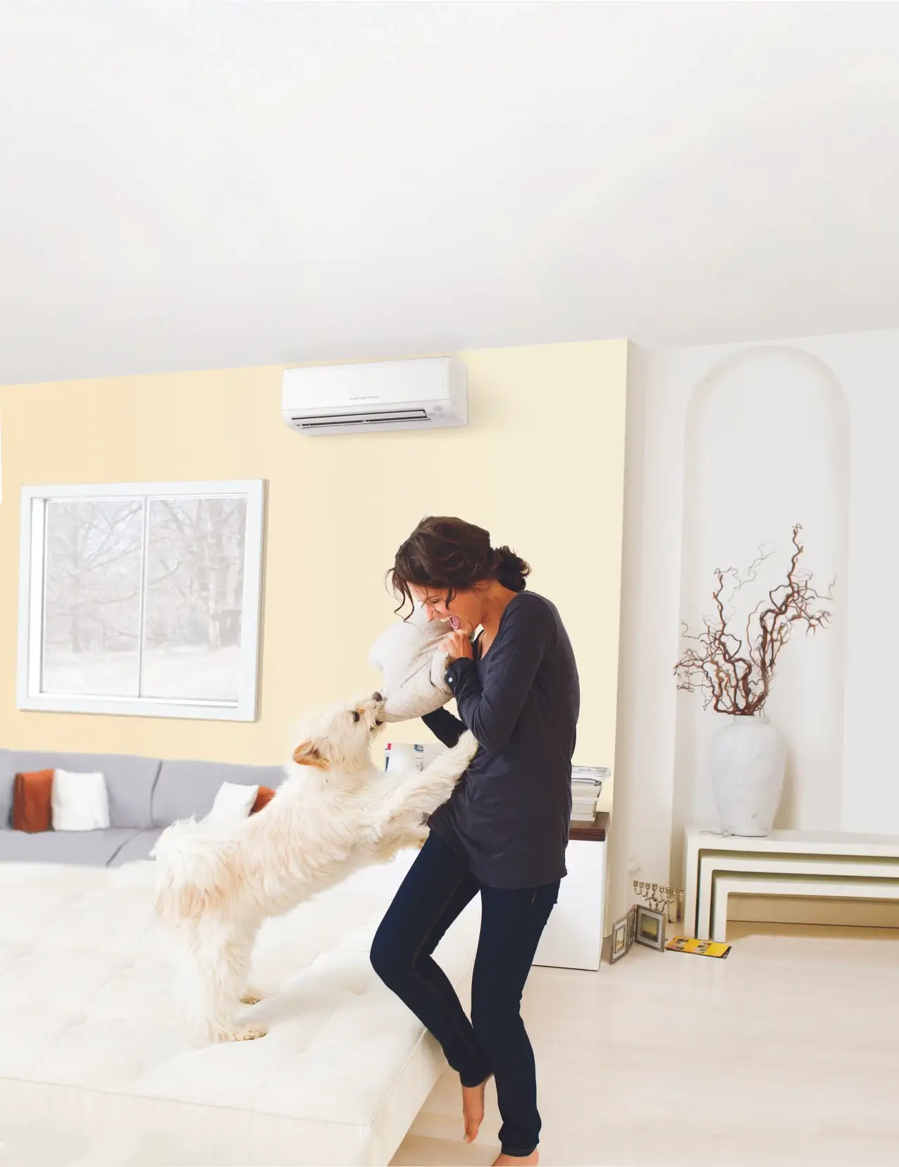 Modern living room setting with a ductless mini split unit providing efficient heating or cooling.